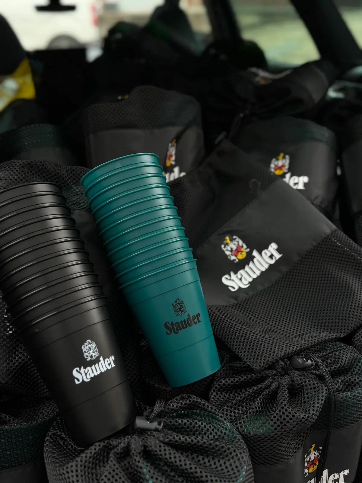 Stauder branded cups and mesh bags